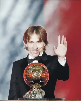  ?? AP FOTO ?? NEW KING. Luka Modric won his first Ballon d’Or, ending the reign of Cristiano Ronaldo and Lionel Messi, who have taken turns winning the coveted title since 2008.