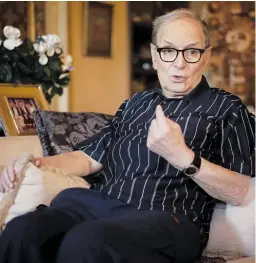 ?? — AP ?? Three- time best sound- track Oscar winner Ennio Morricone answers questions during an interview. The Oscar- winning composer is back on his feet after cancelling a string of concerts because of a collapsed vertebrae.