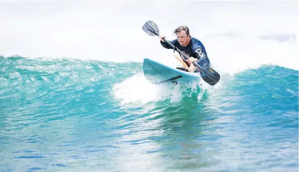  ?? — TREVOR CLARK ?? Winter Paralympia­n Josh Dueck enjoys the waves, too, competing in the Duke Ocean Fest in Waikiki, Honolulu, Hawaii.