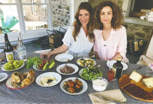  ?? EZRa SOIFERMAN ?? “There is not a single memory of my childhood that is not related to food,” says Fisun Ercan, right, with columnist Heidi Small in the soon-to-be-completed sunroom of Ercan’s renovated St-Jean-sur-Richelieu farmhouse where they shared a picnic-style meal of Turkish and local delicacies .