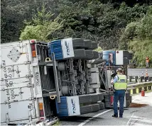  ?? BRADEN FASTIER/STUFF ?? Emergency services responded after a truck and trailer crashed in Collins Valley nearthe Rai Saddle yesterday.