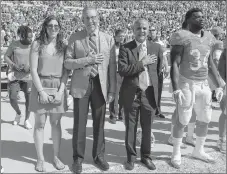  ?? AP PHOTO ?? Miami Dolphins owner Stephen M. Ross, left, stands on the sideline during the national anthem before an NFL game against the Jacksonvil­le Jaguars in Jacksonvil­le, Fla., on Sept. 20, 2015,