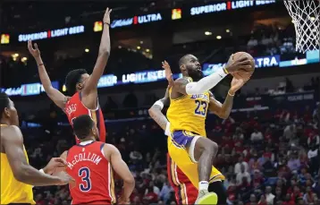  ?? GERALD HERBERT — THE ASSOCIATED PRESS ?? Lakers forward LeBron James goes to the basket in a play-in tournament game against the Pelicans on Tuesday in New Orleans.