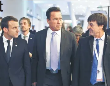  ??  ?? French France’s President Emmanuel Macron (left) , former Governor of California and US actor Arnold Schwarzene­gger (centre) and French Minister for the Ecological and Inclusive Transition Nicolas Hulot (right) leave the One Planet Summit in...