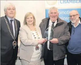  ??  ?? The Best Marching/Uniform award is handed to Paddy Murphy on behalf of The Stackstead­s Boomernag Band by Rory Benville, President Bray Chamber; Cllr Tracy O'Brien, Cathaoirle­ach Bray Town Council; and PJ Minogue.