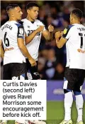  ??  ?? Curtis Davies (second left) gives Ravel Morrison some encouragem­ent before kick off.