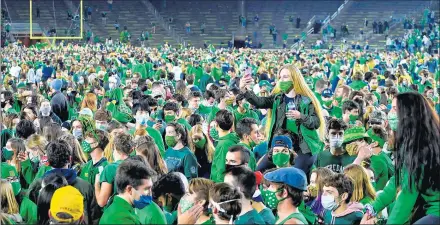  ?? MATT CASHORE/USA TODAY ?? Fans storm the field after the Notre Dame Fighting Irish defeated the Clemson Tigers 47-40 in double overtime at Notre Dame Stadium on Nov. 7 in South Bend, Indiana.