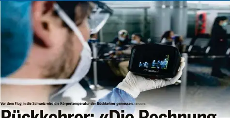  ?? KEYSTONE ?? Vor dem Flug in die Schweiz wird die Körpertemp­eratur der Rückkehrer gemessen.