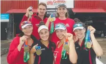  ??  ?? Rowers (from left) Phoebe Robinson, 17, Cormac KennedyLev­erett, 18, Jess Scott, 18, Leukie Smith, 17, Jackson Free, 19, and Hilary Ballinger, 17, with their medal haul.
