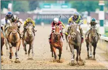  ?? ?? Luis Saez rides Secret Oath, (second from right), across the finish line to win the 148th running of the Kentucky Oaks horse race at Churchill Downs, on May 6, in Louisville, Ky. (AP)