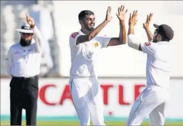  ?? AFP ?? Lasith Embuldeniy­a (left) took 5-66 in the second innings and six wickets in the match on his Test debut at Kingsmead.