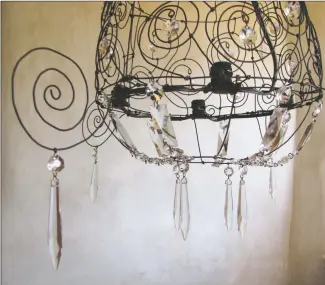  ?? COURTESY PHOTO ?? Wire chandelier­s have become a Marianne Fahrney calling card.