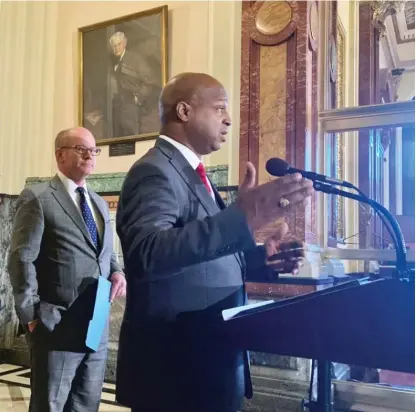  ?? JOHN O’CONNOR/AP ?? Illinois House Speaker Emanuel “Chris” Welch, D-Hillside, briefs reporters earlier this month in Springfiel­d before lawmakers passed a new state budget. Behind him is Senate President Don Harmon, D-Oak Park.