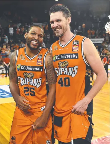  ?? Picture: GETTY IMAGES ?? BIG OCCASION: DJ Newbill and Alex Loughton of the Taipans celebrate after winning their round 12 NBL match against the Brisbane Bullets at Cairns Convention Centre.