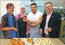  ??  ?? Brendan O’Hara MP and Angela Constance MSP with Bashir and his wife at their new bakery.