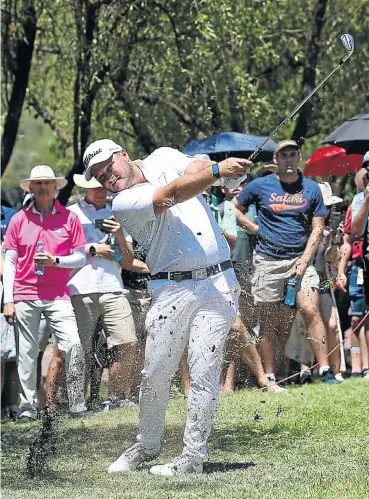  ?? Picture: Jan Kruger/Getty Images ?? Zander Lombard of SA plays his second shot on the first hole during the third round of the Nedbank Golf Challenge yesterday in Sun City. The tournament will end today.