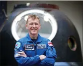  ??  ?? „ Astronaut Tim Peake with the Soyuz capsule.