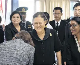  ?? Lillian Suwanrumph­a AFP/Getty Images ?? PRINCESS Maha Chakri Sirindhorn, center, attends a World Food Day event in Bangkok. A U.N. agency named her a “special ambassador for zero hunger.”