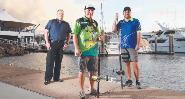  ?? Picture: BRENDAN RADKE ?? REEL DEAL: Yorkeys Knob Boating Club general manager Matthew Simpson, rear commodore Darren Hendrie and major sponsor Ron Bruggemann expect strong participat­ion in the Compleat Angler Light Tackle Slam fishing tournament.