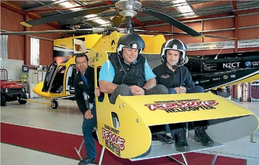  ??  ?? Having a spin in the mini Taranaki Community Rescue Helicopter are, from left, Mike Parker, Ray Hayward, and Andy Cronin.