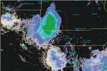  ?? Associated Press ?? The green blotch on this National Weather Service radar shows the Southern California ladybug swarm Tuesday.