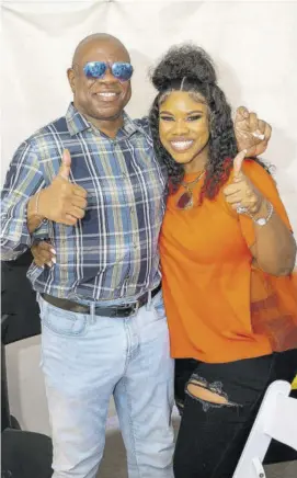  ?? ?? King’s Counsel Ian Wilkinson and Khadine “Miss Kitty” Hylton, attorney-at-law and media personalit­y, are all smiles.