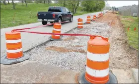  ?? NWA Democrat-Gazette/DAVID GOTTSCHALK ?? Work continues April 24 on Wagon Wheel Road near North 64th Street in Springdale. The Springdale Public Works Department is adding an additional lane.