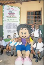  ??  ?? GETTING TO KNOW YOU: Pupils at a Nal’ibali reading club with their costumed reading coach