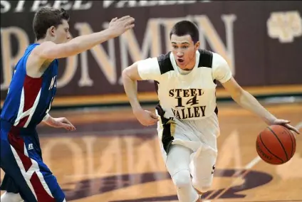  ?? John Heller/Post-Gazette ?? Steel Valley’s Brandon Donovan, right, driving against Laurel Highlands’ Andy Cavinee, was a standout in three sports for the Steel Valley Ironmen, earning him PG South Xtra Male Athlete of the Year honors.