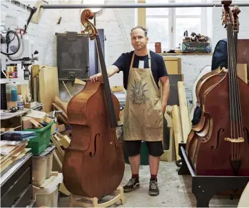  ?? Interview by Jessica Carpani. Photograph­s by Alice Whitby ?? Clockwise from main Luthier Martin Penning in his Somerset studio; a close look at the f-holes; an unvarnishe­d front section and (behind) assembled instrument­s.