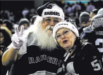  ?? Heidi Fang Las Vegas Review-Journal @HeidiFang ?? A Raiders fan is dressed like Santa Claus during the Dec. 17 game against the Dallas Cowboys in Oakland, Calif. Contructio­n of a new stadium in Las Vegas for the Raiders will start in 2018.