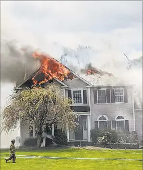  ?? Contribute­d photo / Stony Hill Volunteer Fire Company ?? A fire damages a home on Walnut Hill Road in Bethel on Saturday.