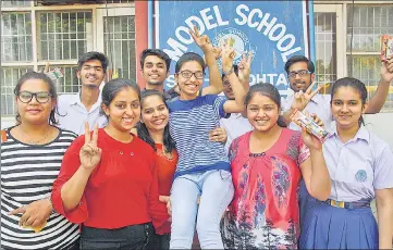  ?? MANOJ DHAKA/HT ?? Girls of Class 12 celebratin­g their success at a school in Rohtak, after the declaratio­n of CBSE results on Saturday.