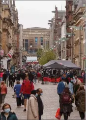  ??  ?? A busy Glasgow city centre as shoppers turned out