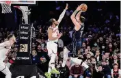  ?? Bebeto Matthews/associated Press ?? Luka Doncic, right, led Dallas with 30 points in a rout of the Knicks at Madison Square Garden.