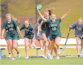  ?? ULYSSES MUÑOZ/BALTIMORE SUN ?? St. Paul’s players, celebratin­g a win over Notre Dame Prep on March 25, had more to cheer about Monday as the No. 1 Gators jumped all over No. 2 McDonogh early and rolled to a 17-8 home win.