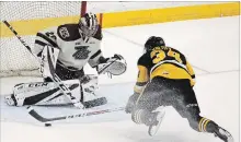  ?? CLIFFORD SKARSTEDT/EXAMINER ?? Peterborou­gh Petes goalie Hunter Jones stops the Hamilton Bulldogs' Arthur Kaliyev during first period OHL action on Saturday.