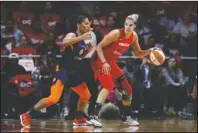  ?? The Associated Press ?? MYSTIC DRIVER: Washington Mystics forward Elena Delle Donne, right, drives against Connecticu­t Sun forward Alyssa Thomas Sunday in the first half of Game 1 of the WNBA Finals in Washington.