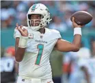  ?? JASEN VINLOVE/USA TODAY SPORTS ?? The Dolphins’ Tua Tagovailoa threw three TD passes Sunday against the Browns.