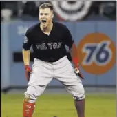  ?? David J. Phillip The Associated Press ?? Boston’s Brock Holt rejoices after a ninth-inning double, a huge part of the decisive Game 4 rally.