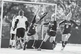  ?? BRIAN KRISTA/BALTIMORE SUN MEDIA GROUP ?? South River’s Caroline Kerr, center, celebrates scoring the first goal as teammates Morgan Lee and Jessie Wynne, right, join in during the Class 4A state final at Washington College.