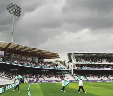  ?? Reuters ?? Umpires walk on the pitch for an inspection during the first day of the second Test in Lord’s yesterday.