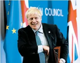  ?? FRANK AUGSTEIN/AP ?? Britain’s Boris Johnson said he was “convinced” that when lawmakers read the EU deal, “they will want to vote for it.”