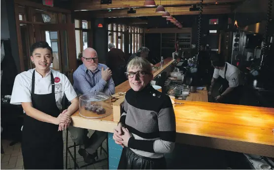 ?? PHOTOS: LEAH HENNEL ?? Kevin Yang, left, Kirk Shaw, centre, and Jackie Cooke at Provision Restaurant, which offers a park-inspired lodge-style atmosphere and well executed menu.
