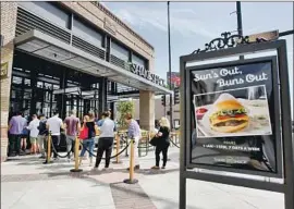  ?? Raul Roa Times Community News ?? SHAKE SHACK was among the high-profile companies that returned huge Paycheck Protection Program loans. It’s not clear now how many jobs the loans saved.