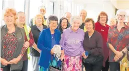  ??  ?? The birthday girl and her daughter Ruth left surrounded by wellwisher­s from the Katikati Lions Club.