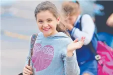  ?? ADVENTURE: A Willows student at Townsville Airport yesterday after arriving by plane from Tully. Picture: ZAK SIMMONDS ??