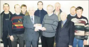  ??  ?? Michael O’Riordan, managing director Mitchelsfo­rt Contractin­g Ltd., presenting a sponsorshi­p cheque to Dan Kearney, chairman Watergrass­hill GAA in the presence of Sean O’Riordan, treasurer; Pat O’Connor, assistant secretary; Dan O’Reilly; John Desmond, vice chairman; Danny O’Farrell; Jim Sarsfield, East Cork representa­tive; Denis Barry and Jonathan Jamel.