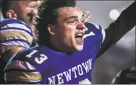  ?? Kassi Jackson / Associated Press ?? Newtown’s Riley Ward looks back at his teammates after scoring the winning touchdown as the Nighthawks beat the Darien Blue Wave in the final play of the Class LL state football championsh­ip Saturday.