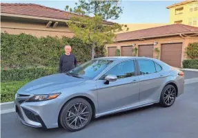  ?? P. ANN LU ?? Eric Young bought a 2021 Toyota Camry for about $27,000. “Buying a used car for me is tough – if I knew the owner, that’s a different story,” he says.